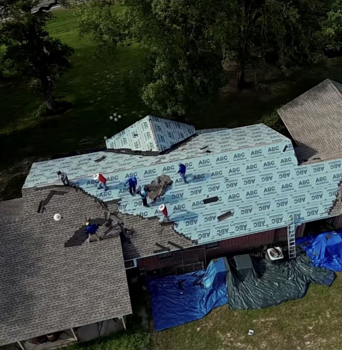 RC21 LLC crew tearing off and replacing a roof in Titus County, Texas